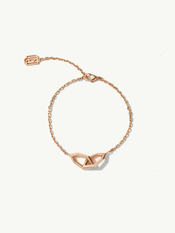 Emerald - cut diamond engagement ring set in a modern titanium bandAmanti Chain Link Bracelet In 18K Rose Gold