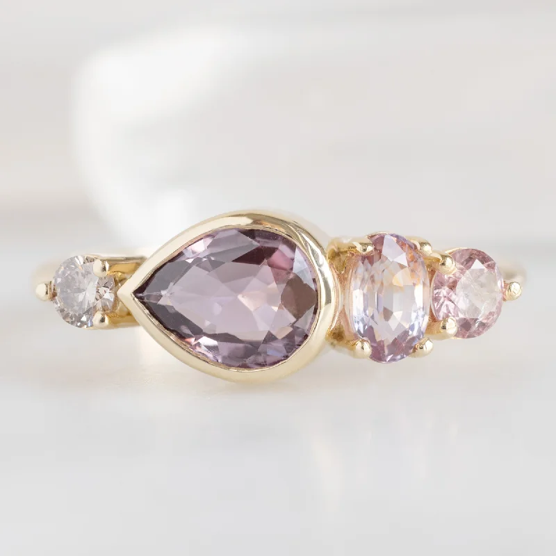 Men's Alexandrite Engagement Rings in Platinum with a Hidden Halo of DiamondsThe Watercolor Ring | 1.27ct Pear Magenta Sapphire in 14K Yellow Gold