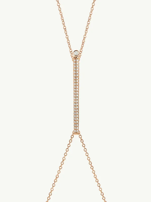 Three - stone diamond engagement ring in rose gold, symbolizing past, present, and futureAracelis Body Chain Necklace With Brilliant Pavè-Set Diamonds in 18K Rose Gold