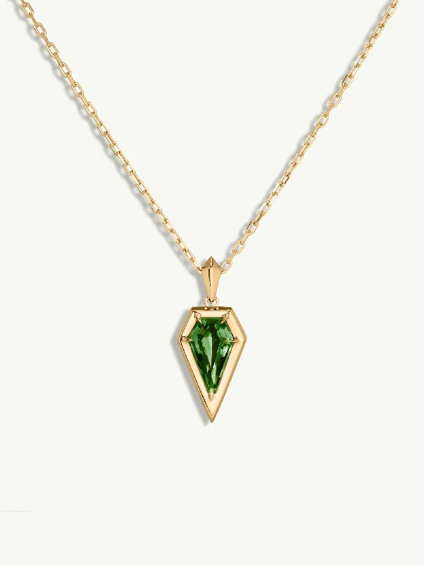 Three - stone diamond engagement ring in rose gold, symbolizing past, present, and futureAphrodite Amulet Pendant Necklace With Green Tourmaline In 18K Yellow Gold