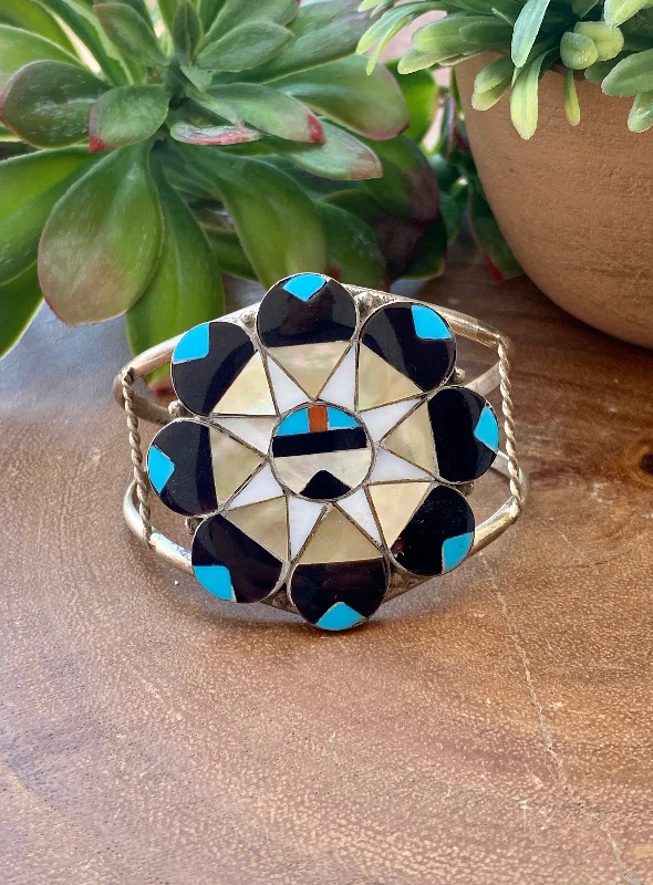 Stackable Women's Cuff Bracelets in Different Sizes and Materials for Layered StylingAlison Dishta Zuni Multi Stone & Sterling Silver Sunface Inlay Cuff Bracelet