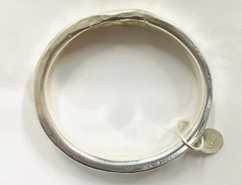 Unisex Bangle Bracelets with Abstract Artwork for a Unique StatementAnvil bangle oval silver