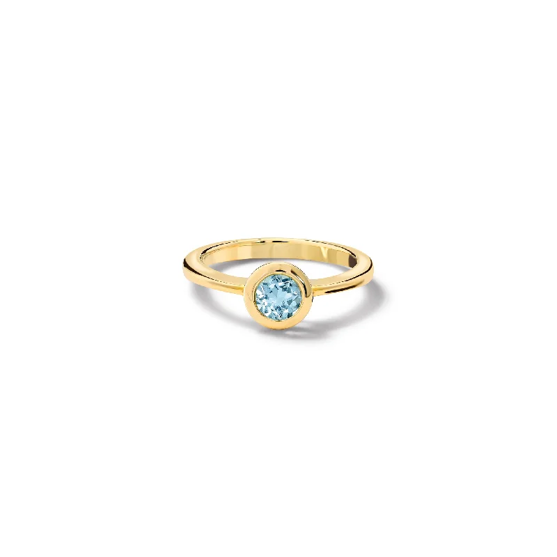 Classic Round Cut Engagement Rings with Platinum Prongs and Halo Setting for Timeless EleganceNicole Ring Yellow Gold - Blue Topaz