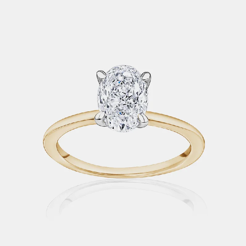 Solitaire Engagement Rings with a High - Clarity Round Diamond and Tapered BandOval Cut Engagement Ring with a Hidden Halo