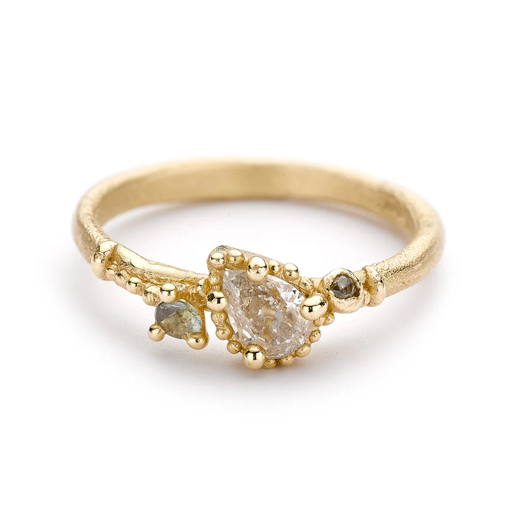 Pear - Shaped Engagement Rings in Yellow Gold with a Diamond - Encrusted BandSolitaire Champagne Diamond Ring with Beaded Setting