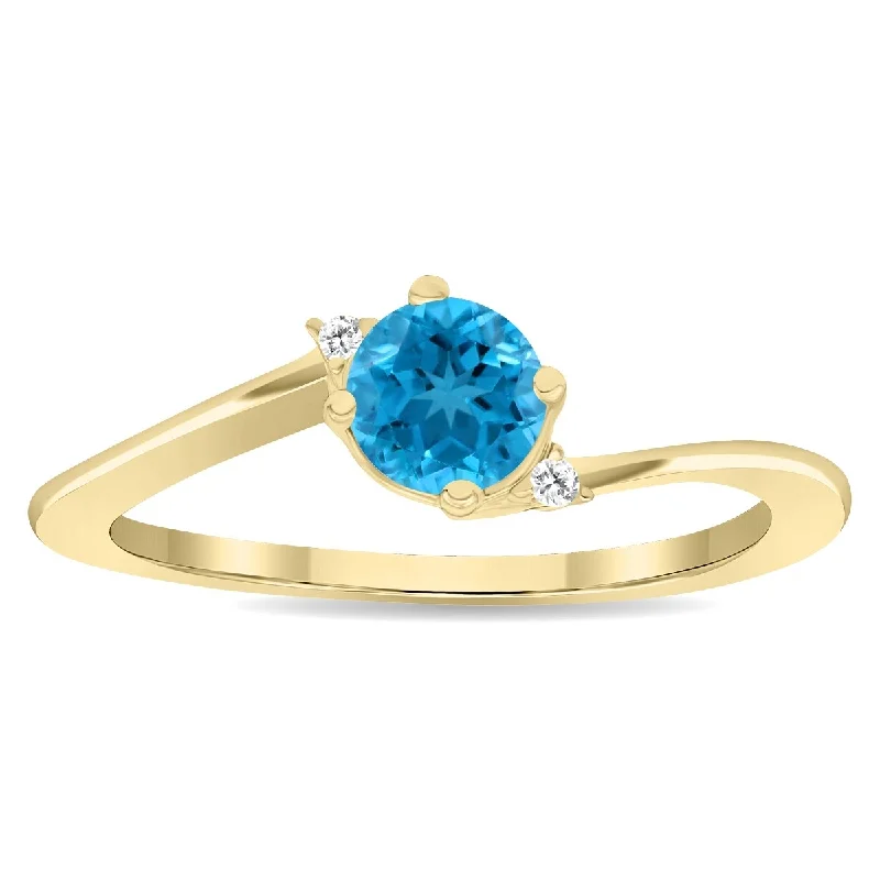 Malachite Gemstone Rings in 14K Gold with a Carved Stone for a Unique and Artistic AppealWomen's Round Shaped Blue Topaz and Diamond Wave Ring in 10K Yellow Gold