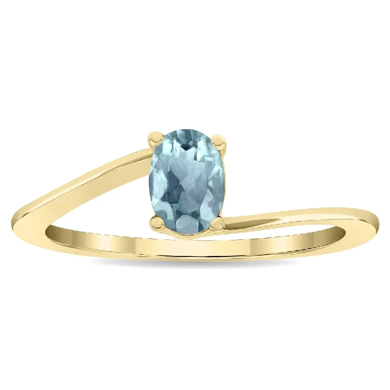 Tanzanite Gemstone Rings in 10K Gold with a Trilogy Design for a Sophisticated GiftWomen's Solitaire Oval Shaped Aquamarine Wave Ring in 10K Yellow Gold